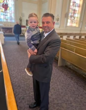 John Keane with his grandchild. 