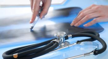 Image of a doctor pointing at pleural mesothelioma from a scan.