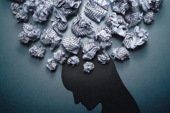 Silhouette of depressed person head. Concept image of depression and anxiety. Waste paper and head silhouette. | Image credit: © tadamichi - stock.adobe.com
