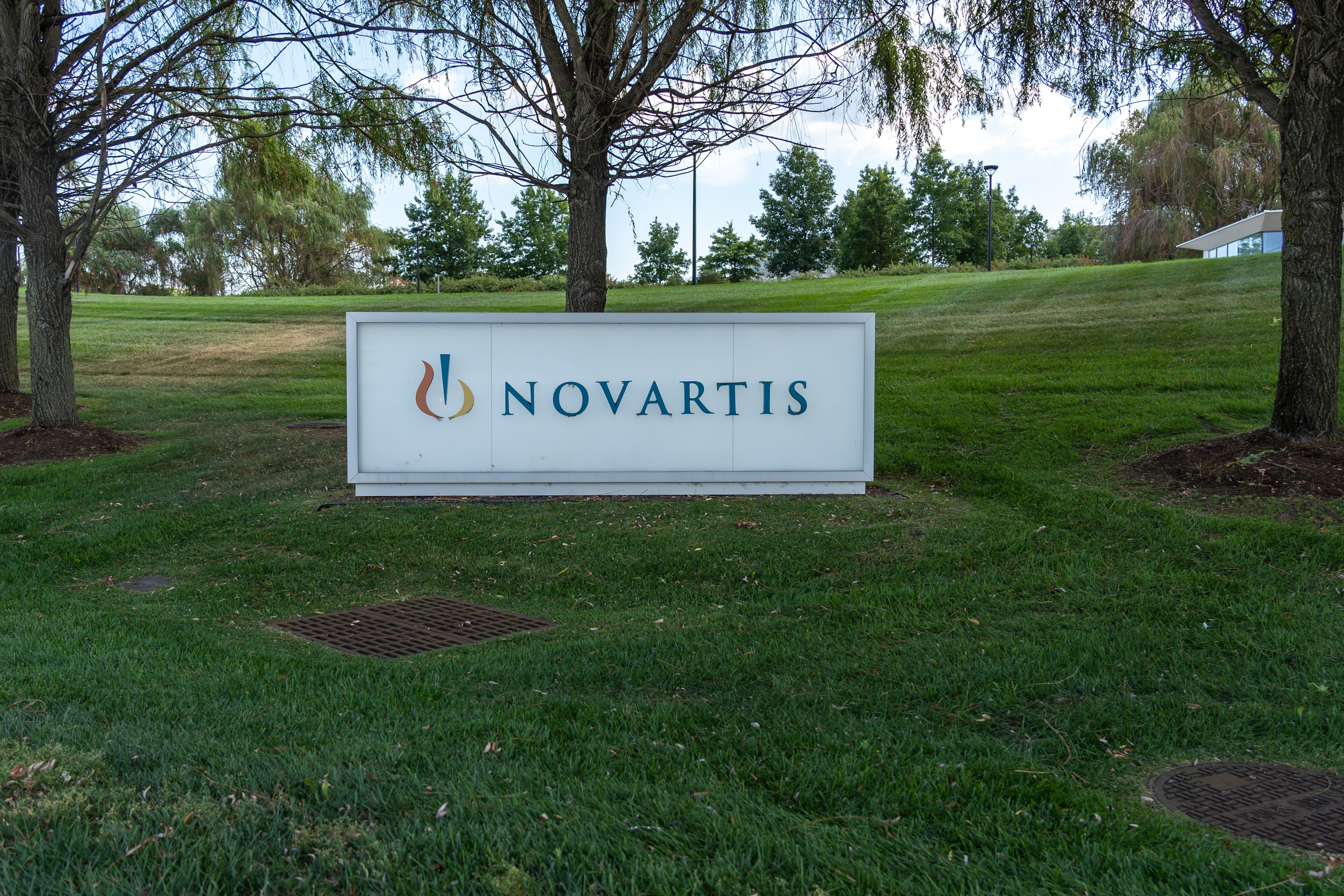 East Hanover, NJ, USA - August 16, 2022: Novartis sign at its headquarters in East Hanover, NJ, USA. Novartis AG is a Swiss-American multinational pharmaceutical corporation. | Image credit © JHVEPhoto
