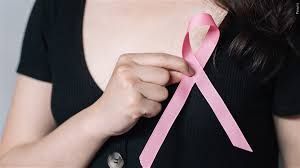 Image of woman with pink robbon.