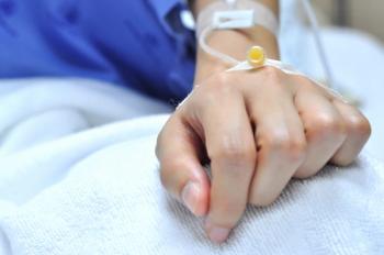 Image of a person receiving treatment via an IV drip.