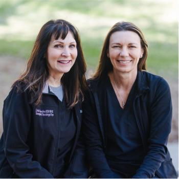Two oncology nurses wearing blue and smiling at the camera; From left: Linda Giamalva, B.S.N., RN-BC, NC IV and Allegra Jones, M.S.N., RN, CA-SANE  Photo by Samantha Wiley