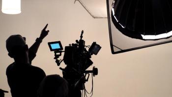 shadowed silhouette of a cameraman