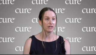 Dr. Alex Francoeur interviewing against a gray CURE background