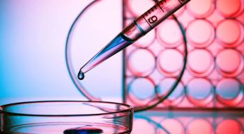 Image of a pipet dropping liquid into a petri dish.