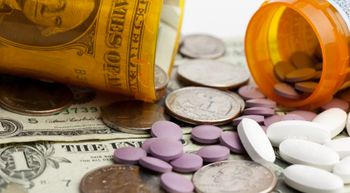 pills splayed out over money