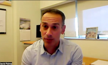 Image of a man wearing a light blue polo shirt.