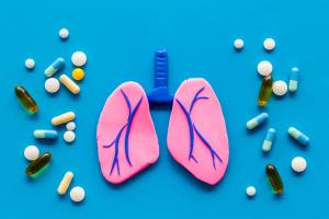 Pink lungs with medications scattered around them