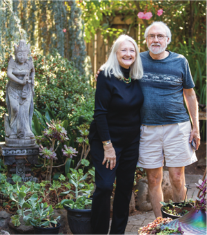 Renata and Ralph Muller standing in front of a garden
