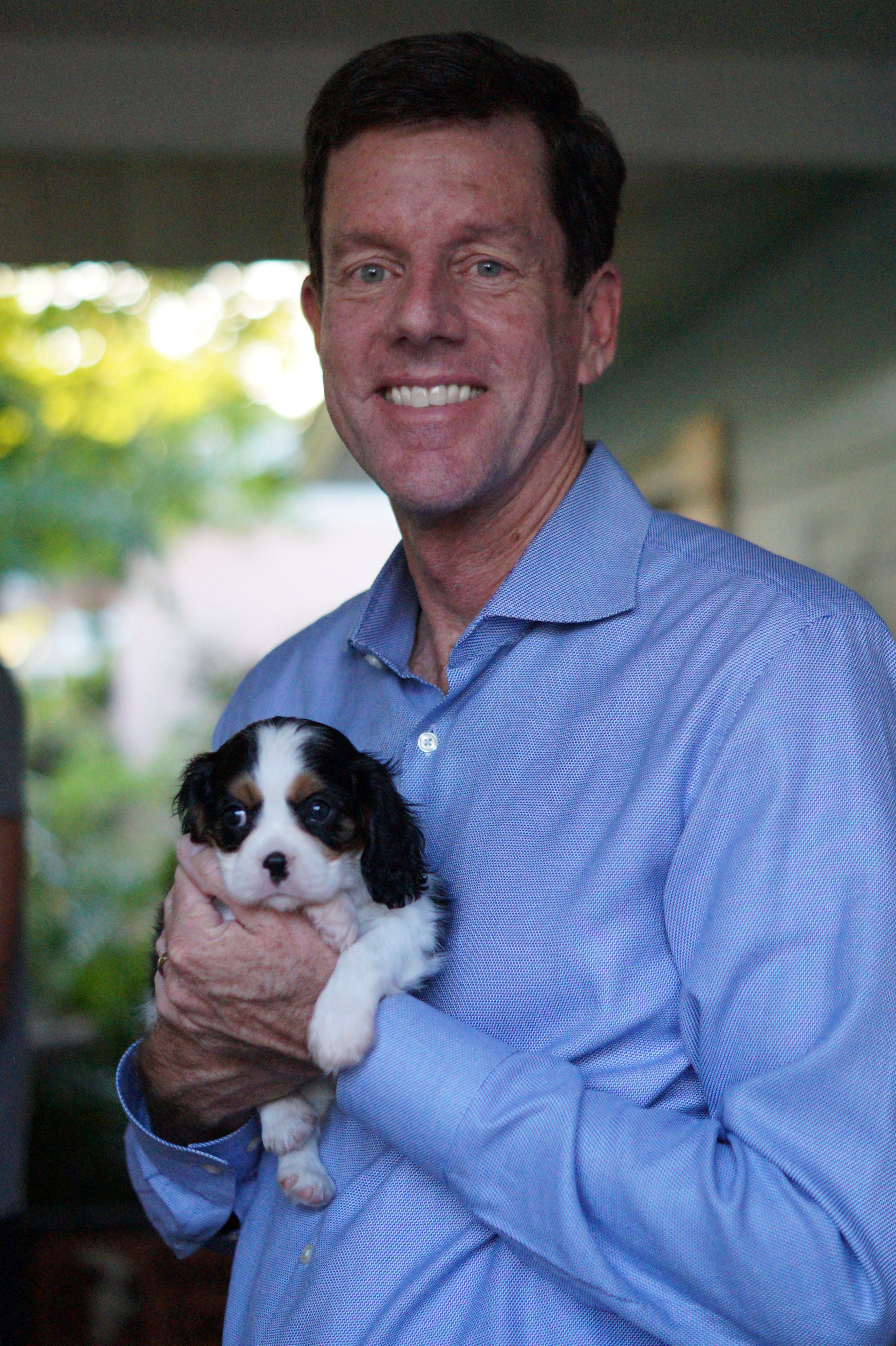 Bill C. Potts holding his small dog, Pippa | Photo credit: Sarah Potts 