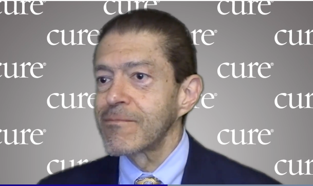 Image of Dr. Jorge Cortes; a man with short dark hair wearing a suit. 