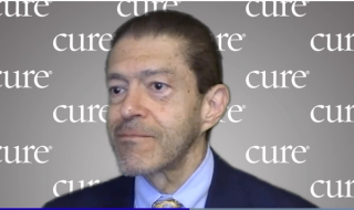 Image of Dr. Jorge Cortes; a man with short dark hair wearing a suit. 