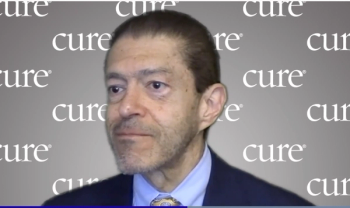 Image of Dr. Jorge Cortes; a man with short dark hair wearing a suit. 
