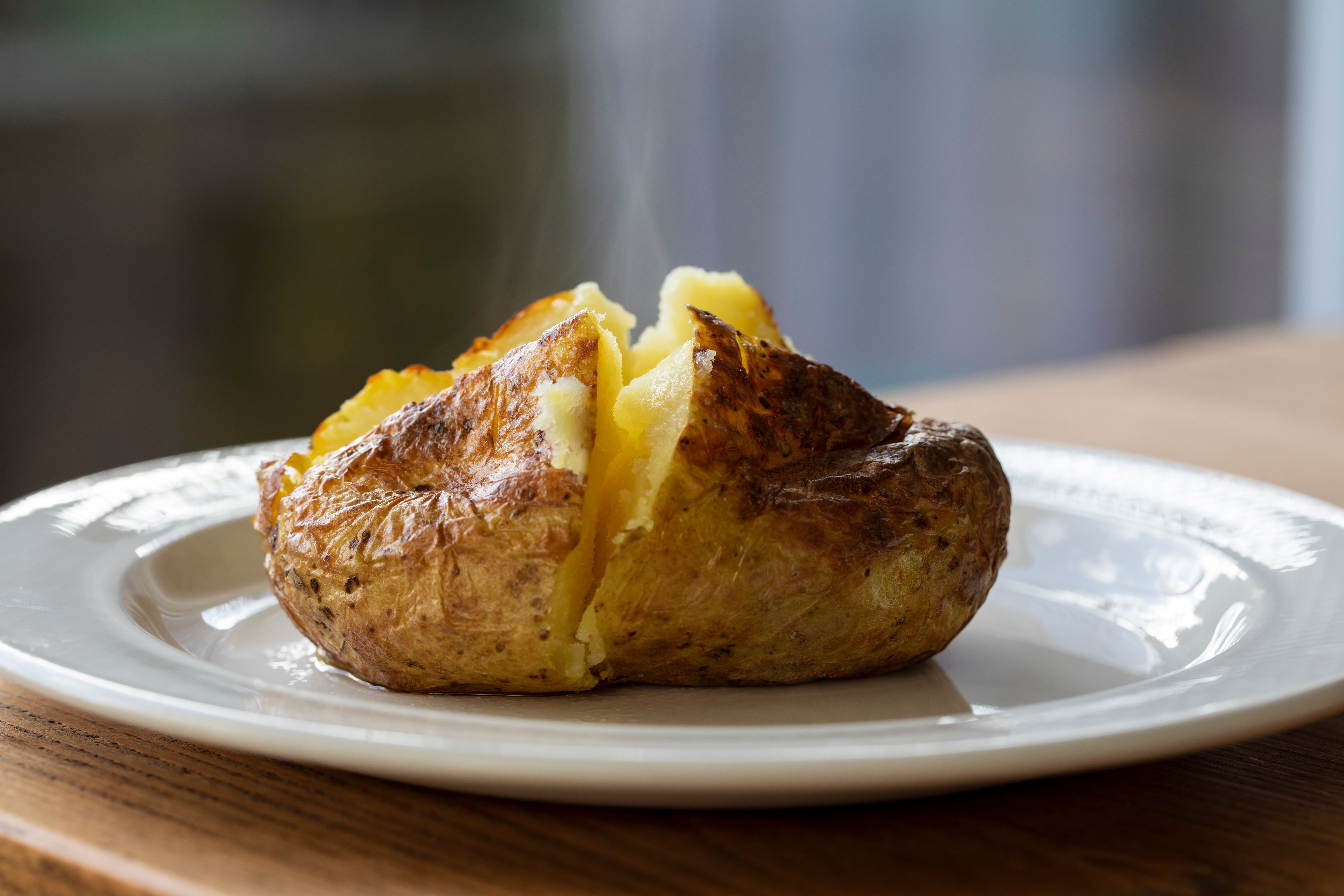 Hot baked potato with crispy skin and melted butter | Image credit: © Magdalena Bujak - © stock.adobe.co