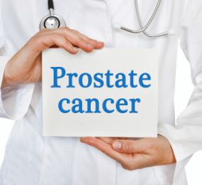 Image of doctor holding sign that says, "Prostate Cancer."