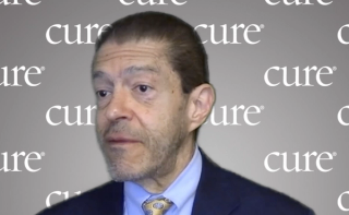 Image of a man with brown hair.