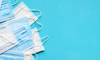 Medical face masks on blue background. Protection against coronavirus, flu and other airborne infection. Copy space | Image credit: © - Soho A studio - ©  stock.adobe.com