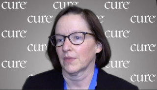 Image of a woman with brown bobbed hair with glasses.