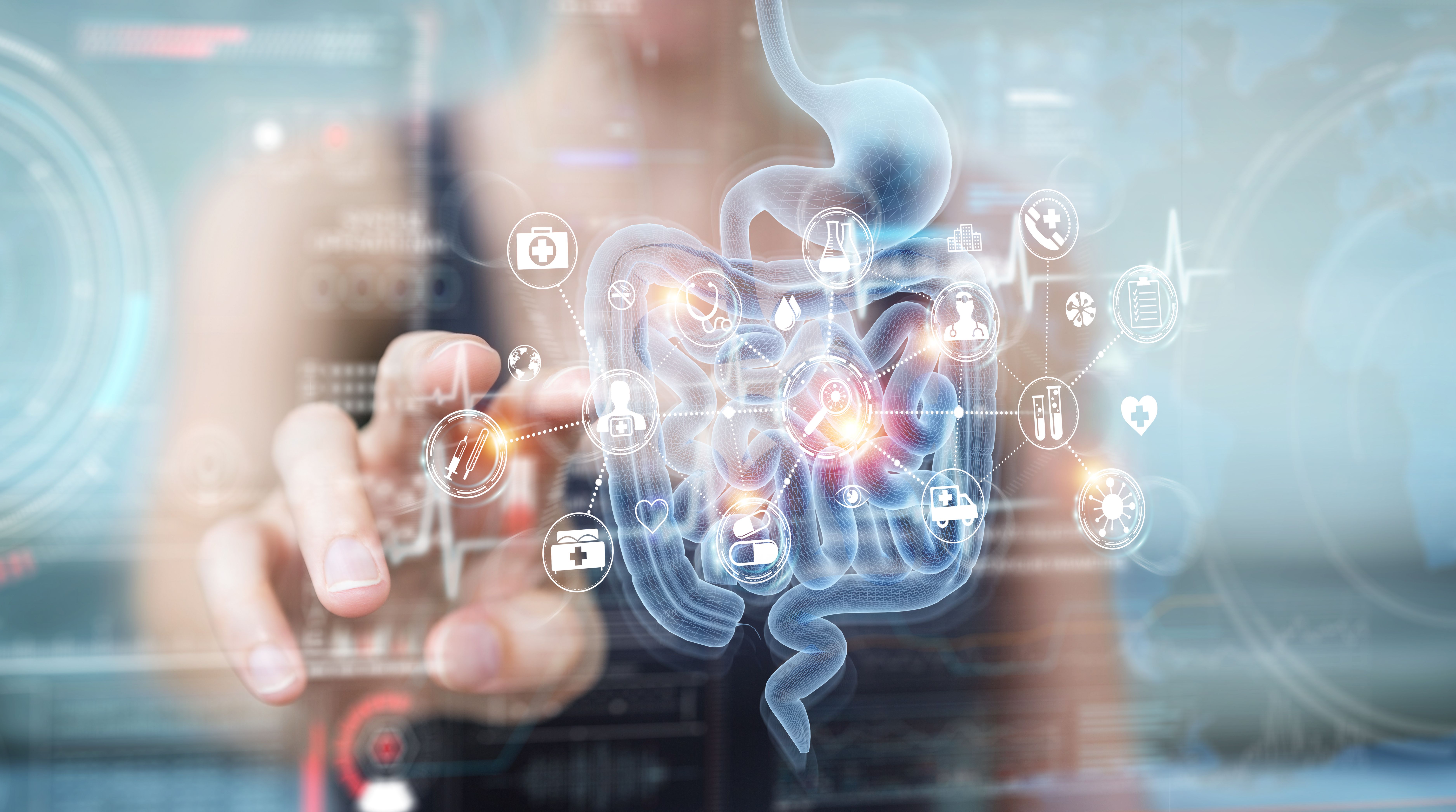 Woman using digital x-ray of human intestine holographic scan projection 3D rendering | Image credit:  © sdecoret - © stock.adobe.com