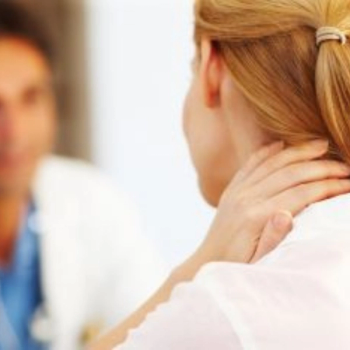 Image of woman holding her neck.