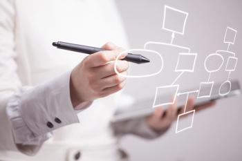 Woman drawing a flow chart