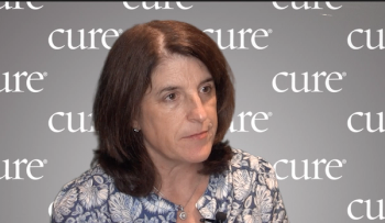 Image of a woman with brown shoulder-length hair in front of a gray background that says CURE.