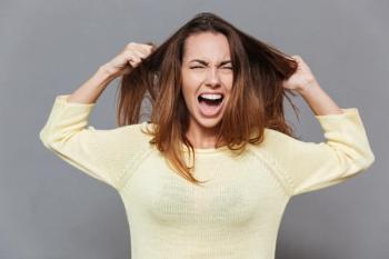 woman pulling hair in frustration