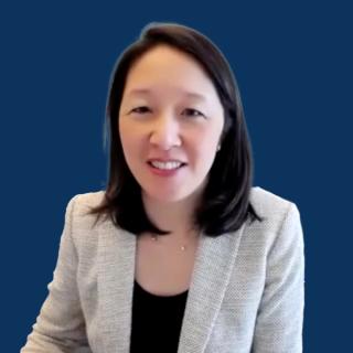 Photo of a woman with shoulder-length black hair wearing a blazer