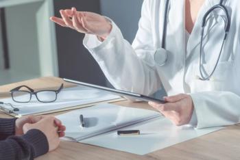 doctor talking to patient