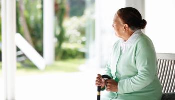 older woman with a cane 