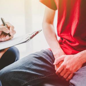 Image of doctor consulting patient.