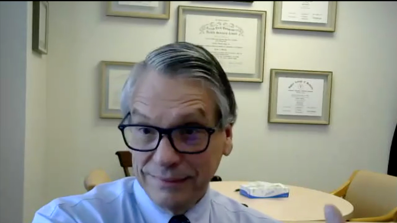 Image od grey haired Doctor. 