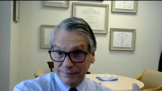 Image od grey haired Doctor. 