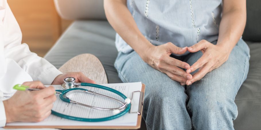 Image of doctor consulting a woman. 