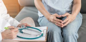 Image of doctor consulting a woman. 