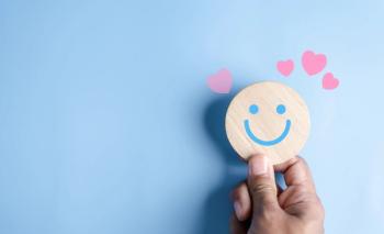 Hands holding blue happy smile face. mental health positive thinking and growth mindset, mental health care recovery to happiness emotion | Image credit: © Kiattisak - stock.adobe.com