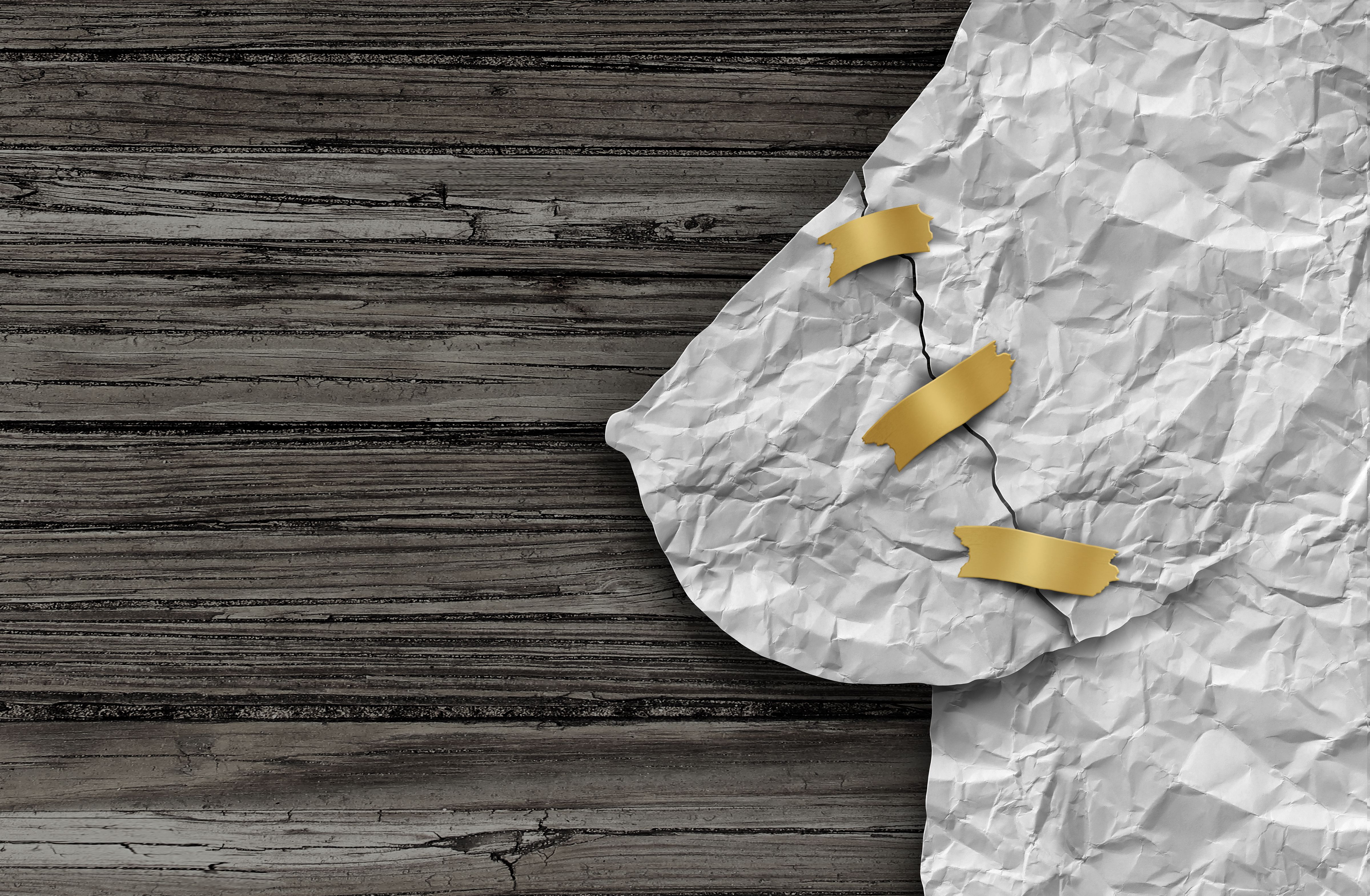 Image of a paper breast crumpled.