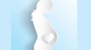 white silhouette of a pregnant woman against a blue background