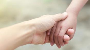 Image of child hand.