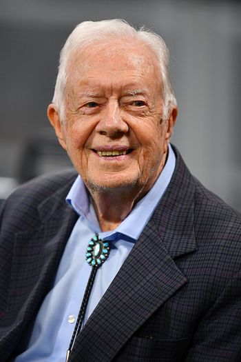 photo of former president Jimmy Carter with a light blue button-up shirt and a dark suit jacket