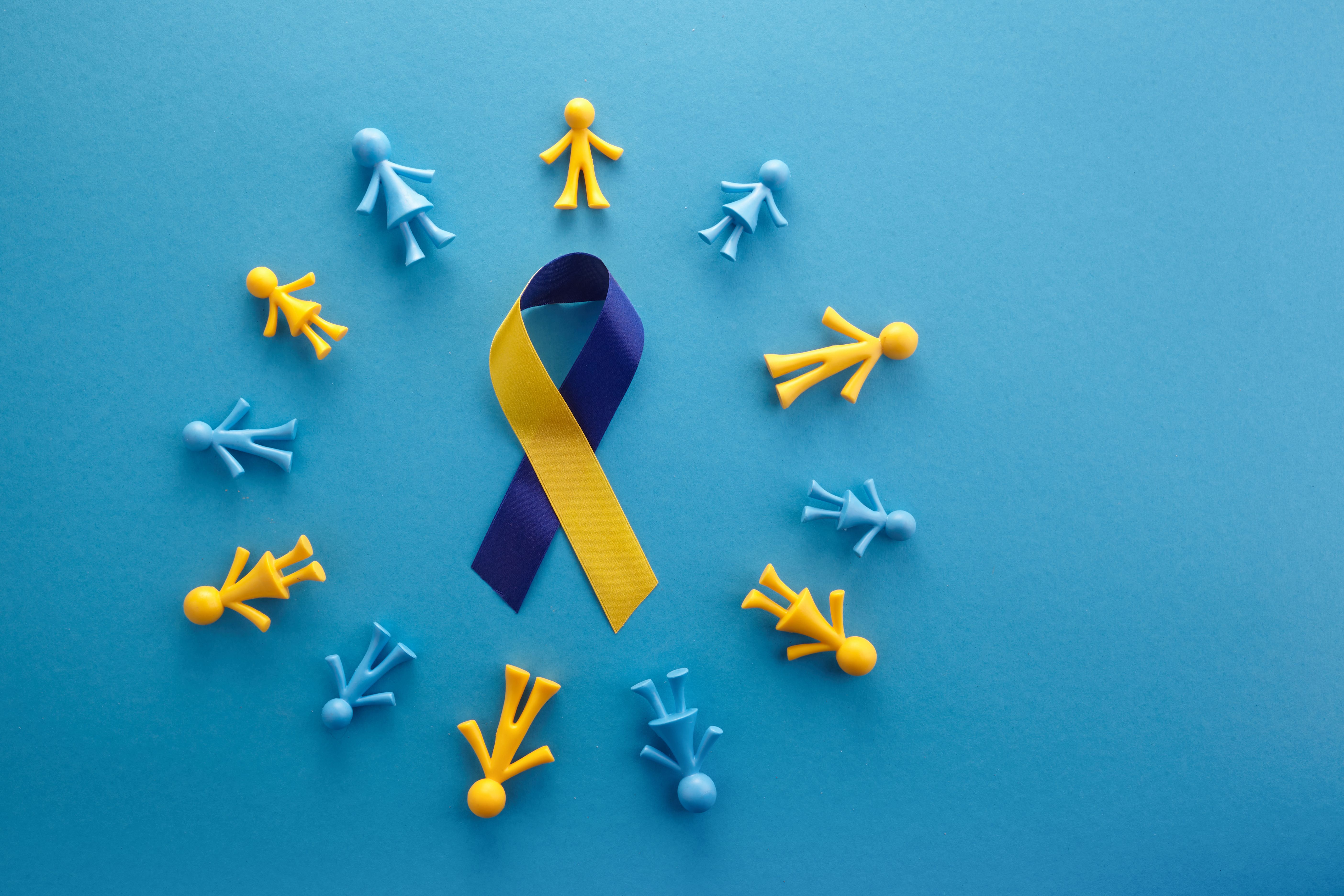 World Down syndrome day on blue background. Down syndrome awareness concept. Top view | Image credit: © vetre - © stock.adobe.com