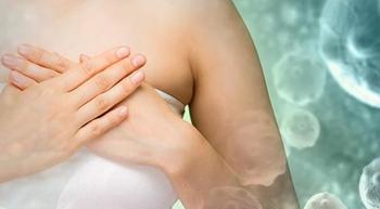 woman holding her hand over her chest