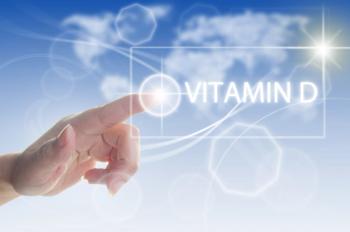 Image of a person pointing at the sun; vitamin D.