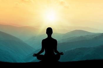 Silhouette of a person doing yoga. 
