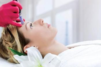woman receiving microneedling treatment