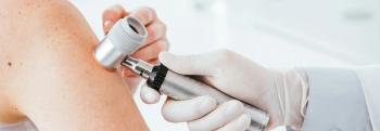 panoramic shot of dermatologist in latex glove holding dermatoscope while examining patient