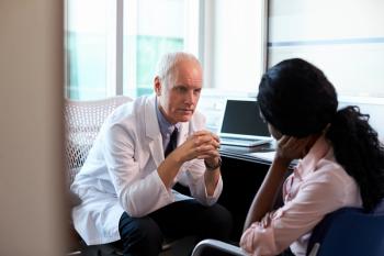 doctor talking to patient