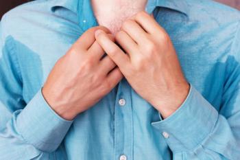 Person with sweat stains under arms