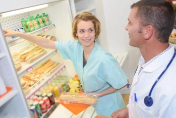 doctor talking to nurse in cafeteria 
